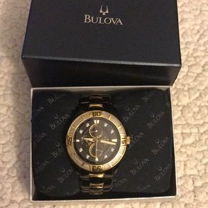 Bulova black and gold with 8 diamonds.